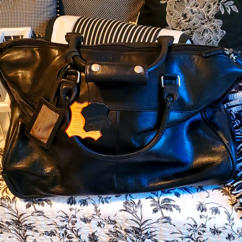 Beautiful leather travel bag with wheels.